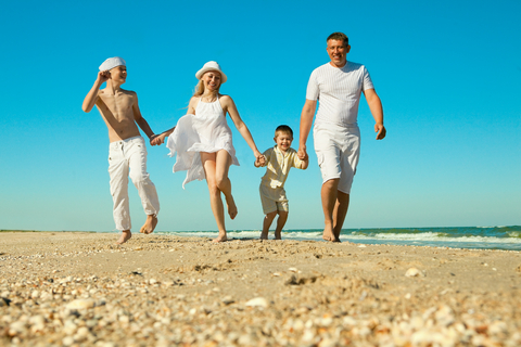 family_walking_on_beach